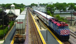 Modern day photo of West Chicago train station and trains on tracks