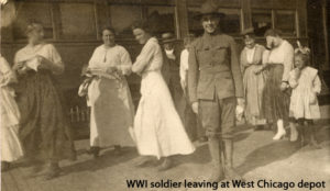 World War 1 soldier leaving train station with people looking on