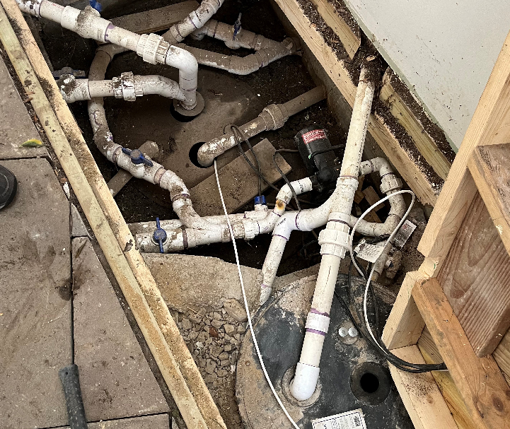 Additional Sump pump installation hidden beneath trap door.
